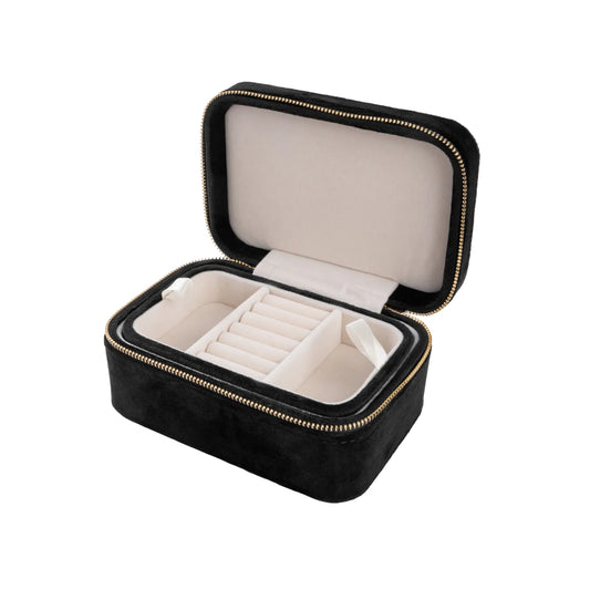 Svart smúkkuskrín við gull lýblási. Víst opið.